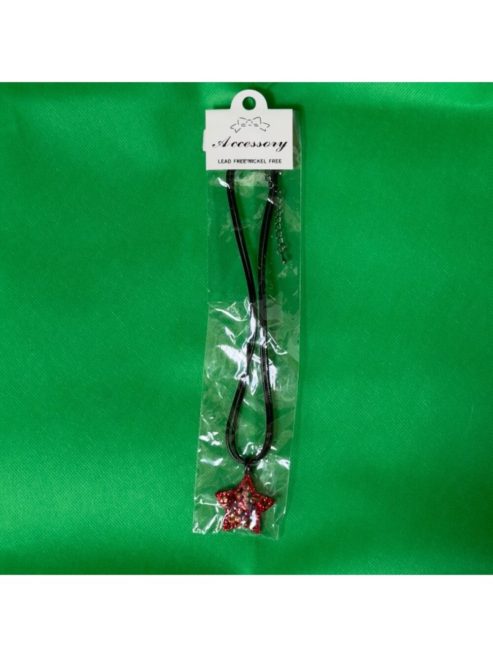 Shimmering iridescent Red Glitter Rhinestone Star Necklace Pendant Black Cord